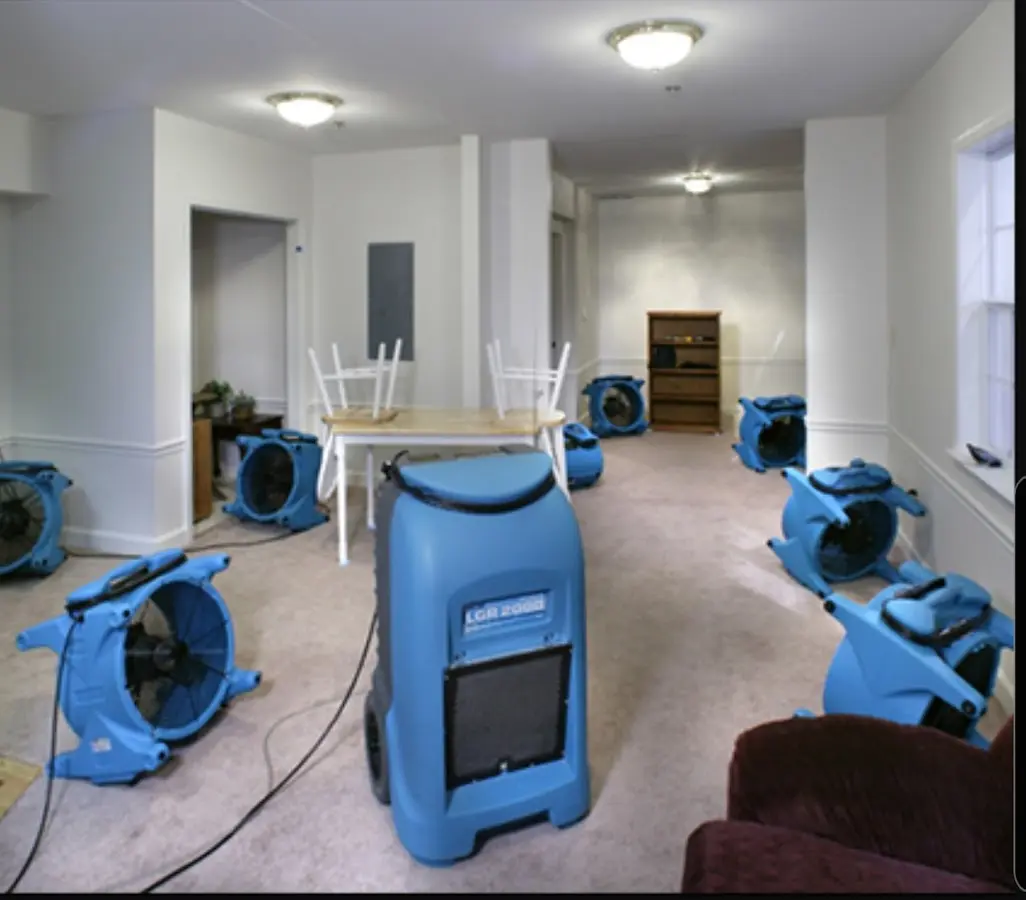 Air movers and dehumidifier setup for Water Damage Restoration in Mont Belvieu